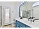 Updated bathroom with a double vanity, blue cabinets, and a walk-in shower at 17124 N Melissa Ln, Surprise, AZ 85374