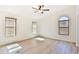 Spacious bedroom with hardwood floors and multiple windows at 17124 N Melissa Ln, Surprise, AZ 85374