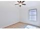 Bright bedroom with wood-look floors and a ceiling fan at 17124 N Melissa Ln, Surprise, AZ 85374