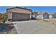 House exterior showcasing a two-car garage and front yard landscaping at 17124 N Melissa Ln, Surprise, AZ 85374