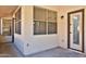 Covered patio with windows and door access from the home at 17124 N Melissa Ln, Surprise, AZ 85374