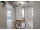 Bright entryway with a decorative tile floor and white door at 1737 E Carob Dr, Chandler, AZ 85286