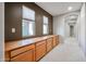 Hallway with built-in cabinets and neutral wall paint at 1737 E Carob Dr, Chandler, AZ 85286