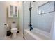 Updated bathroom with patterned tile, a bathtub, and a modern vanity at 17962 W Montecito Ave, Goodyear, AZ 85395