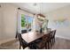 Dining area with patio access and view of backyard oasis at 17962 W Montecito Ave, Goodyear, AZ 85395