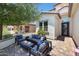 Outdoor seating area with fire pit and modern furniture near the entrance at 17962 W Montecito Ave, Goodyear, AZ 85395