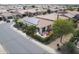 Aerial view of a house with solar panels and a backyard patio at 1806 E Azafran Trl, Queen Creek, AZ 85140