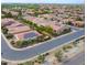 Aerial view of a house with solar panels in a residential area at 1806 E Azafran Trl, Queen Creek, AZ 85140