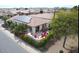 Aerial view of home with solar panels and backyard patio at 1806 E Azafran Trl, Queen Creek, AZ 85140