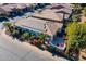 Aerial view of house with solar panels and a patio at 1806 E Azafran Trl, Queen Creek, AZ 85140