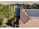 An aerial view of a backyard oasis with patio and trees at 1806 E Azafran Trl, Queen Creek, AZ 85140