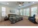 Spacious bedroom with large windows and en-suite bathroom at 1806 E Azafran Trl, Queen Creek, AZ 85140