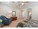 Guest bedroom with en-suite bathroom and comfortable seating at 1806 E Azafran Trl, Queen Creek, AZ 85140