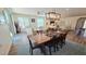 Open-concept space includes hardwood floors, a dining area, and a sitting area for guests at 1806 E Azafran Trl, Queen Creek, AZ 85140