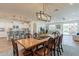 Open concept dining area with a large wooden table and kitchen views at 1806 E Azafran Trl, Queen Creek, AZ 85140