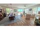 The dining room and sitting area include hardwood floors and many windows for ample natural light at 1806 E Azafran Trl, Queen Creek, AZ 85140