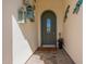 Inviting entryway with decorative lanterns and tile flooring at 1806 E Azafran Trl, Queen Creek, AZ 85140