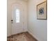 Bright entryway with hardwood floors and arched doorway at 1806 E Azafran Trl, Queen Creek, AZ 85140