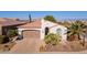 A charming one-story home with a two-car garage at 1806 E Azafran Trl, Queen Creek, AZ 85140
