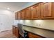 Home office features built-in wood cabinets and desk at 1806 E Azafran Trl, Queen Creek, AZ 85140