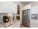 Kitchen boasts granite countertops and stainless steel appliances at 1806 E Azafran Trl, Queen Creek, AZ 85140