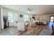 Bright living space featuring hardwood floors, recessed lighting, and a ceiling fan at 1806 E Azafran Trl, Queen Creek, AZ 85140