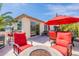 Relaxing patio with fire pit and seating area, perfect for outdoor entertaining at 1806 E Azafran Trl, Queen Creek, AZ 85140