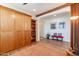 Sitting room with a built-in Murphy bed and wood shelving at 1806 E Azafran Trl, Queen Creek, AZ 85140