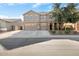 Two-story house with a three-car garage and well-manicured lawn at 18437 W Sunnyslope Ln, Waddell, AZ 85355