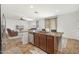 Kitchen island with sink, dishwasher, and granite countertop at 18437 W Sunnyslope Ln, Waddell, AZ 85355