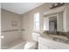 Updated bathroom with granite vanity and a walk-in shower at 205 S Higley Rd # 4, Mesa, AZ 85206