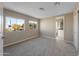 Bright bedroom with two windows and access to a bathroom at 205 S Higley Rd # 4, Mesa, AZ 85206