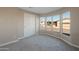 Bedroom with large windows and a view of the community at 205 S Higley Rd # 4, Mesa, AZ 85206