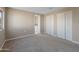 Spacious bedroom with double door closets and neutral carpeting at 205 S Higley Rd # 4, Mesa, AZ 85206