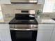 Close up of the kitchen range with stainless steel appliances and granite counter tops at 205 S Higley Rd # 4, Mesa, AZ 85206