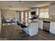 Bright kitchen with stainless steel appliances, granite countertops, and an island with bar stool seating at 205 S Higley Rd # 4, Mesa, AZ 85206