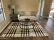 Living room featuring a modern sofa, glass coffee table, and stylish rug at 205 S Higley Rd # 4, Mesa, AZ 85206