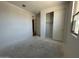Bedroom featuring closet and window with natural light, freshly painted walls at 22836 E Lords Way, Queen Creek, AZ 85142