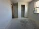 Bedroom showcasing a closet and window with freshly painted white walls at 22836 E Lords Way, Queen Creek, AZ 85142