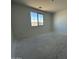Bright bedroom with large window allowing natural light and view at 22836 E Lords Way, Queen Creek, AZ 85142