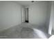 Bright bedroom features a doorway and tile floor at 22836 E Lords Way, Queen Creek, AZ 85142