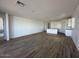 Spacious living room featuring tile floor that opens to the kitchen at 22836 E Lords Way, Queen Creek, AZ 85142