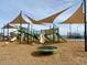 Community playground with shade structures and play equipment at 22836 E Lords Way, Queen Creek, AZ 85142