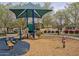 Community playground with play structures and shade at 2286 E Hidalgo Ave, Phoenix, AZ 85040