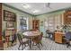 Bright dining area with a round table and view to the street at 232 E Colter St, Phoenix, AZ 85012