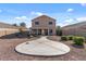 Large backyard with gravel and a circular patio at 24158 N Nectar Ave, Florence, AZ 85132