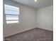 Bedroom featuring new carpet and a window providing lots of natural light at 2690 E Abe Truckle Ave, San Tan Valley, AZ 85140