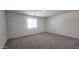 Bedroom featuring a carpet floor, baseboards and a double hung window at 2690 E Abe Truckle Ave, San Tan Valley, AZ 85140