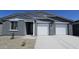 Charming single-story home featuring a two-car garage and low maintenance landscaping at 2690 E Abe Truckle Ave, San Tan Valley, AZ 85140