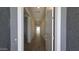 Inviting entryway featuring a long hallway with tile floors and recessed lighting at 2690 E Abe Truckle Ave, San Tan Valley, AZ 85140